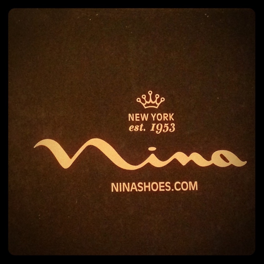 Black faux fur booties by Nina